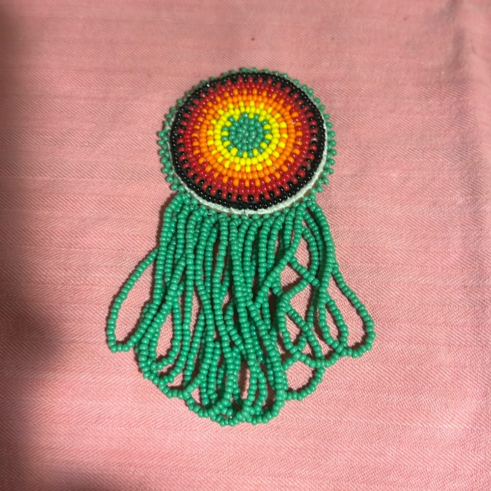 Handmade beaded brooch or pin.